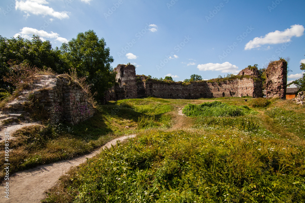 Summer view to castle ruins in Buchach with beautiful sky and clouds, Ternopil region, Ukraine