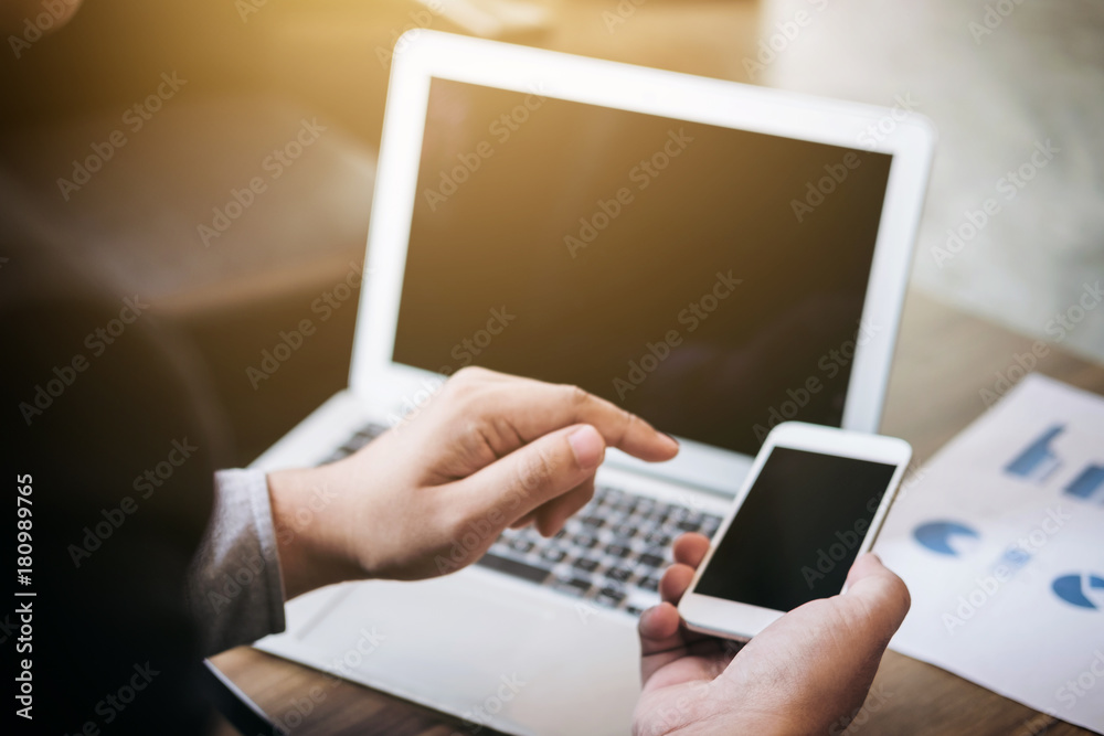 Professional business man working with smartphone, Doing finance on laptop and analysis business strategy to development profit Professional business man working with smartphone, Doing finance on laptop and analysis business strategy to development profit