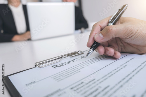 Employment and recruitment concept, Board reading a resume during a job interview and candidate sign contract for new colleagues in company, achievement approve
