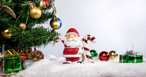 Christmas decoration Holiday or new year with Santa Claus and snowman on snow background and copy space