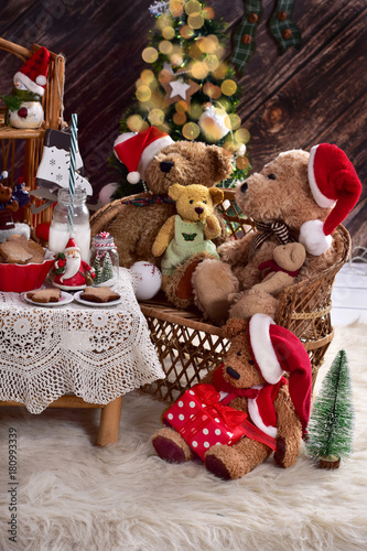 teddy bear family at christmas time with milk and cookies
