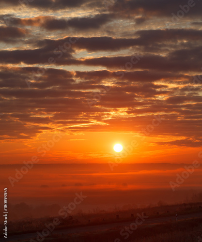 Fototapeta Naklejka Na Ścianę i Meble -  Panoramic landscape with fog in the background of the rising sun.