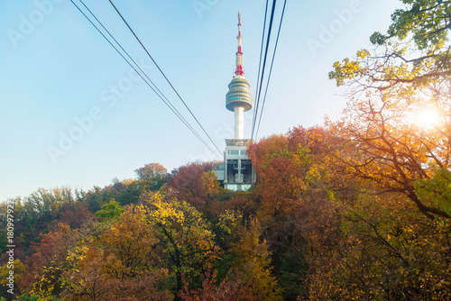 Namsan N Seoul Tower with the line of cable car at the sunset time in autumn at Seoul, South Korea.