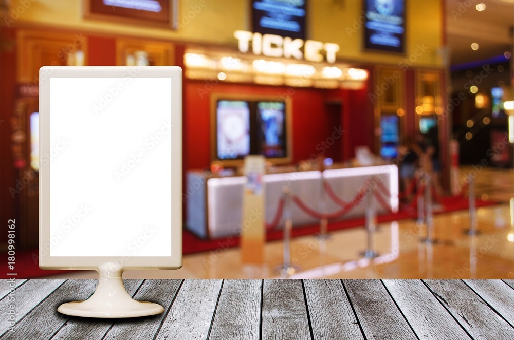 mini blank advertising billboard with blurred image of ticket sales counter at movie theater, copy space for text or media content, advertisement, commercial and marketing concept mini blank advertising billboard with blurred image of ticket sales counter at movie theater, copy space for text or media content, advertisement, commercial and marketing concept