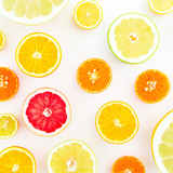Citrus fruit pattern made of lemon, orange, grapefruit, sweetie and pomelo on white background. Juicy concept. Flat lay, top view.