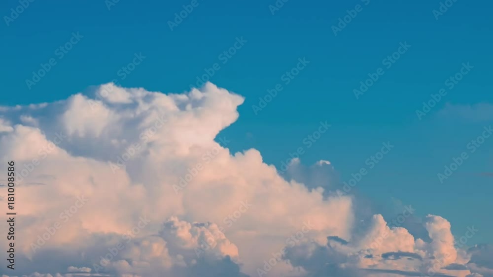 Timelapse, seamless, moving fluffy cloud over on the blue sky before sunset. Timelapse, seamless, moving fluffy cloud over on the blue sky before sunset.