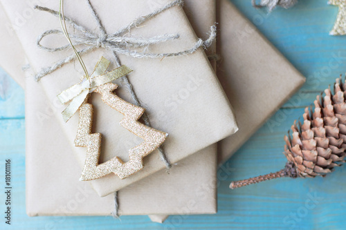  Preparation for the new year. Gifts, scissors, ribbon and bumps on a wooden background