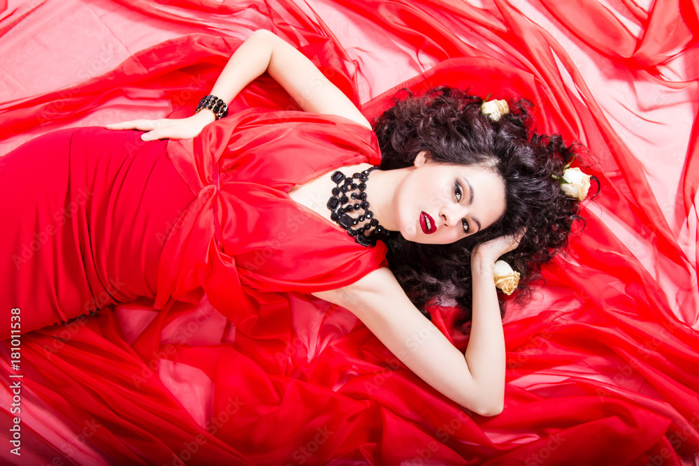 Naklejka premium caucasian girl with brunette hair on red dress