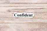 confident of the word on paper. concept. Words of confident on a wooden background
