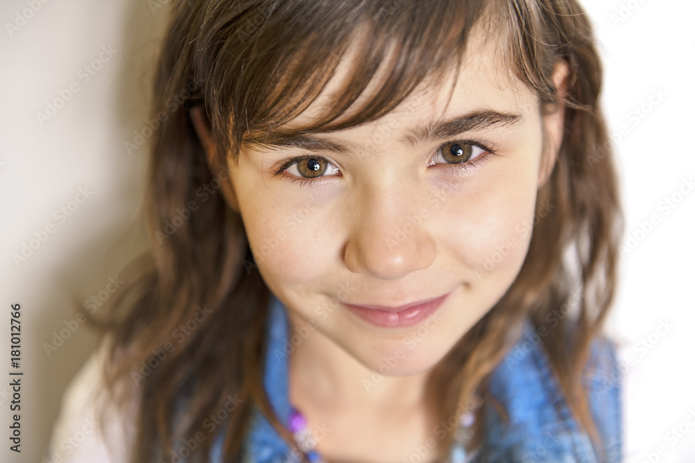 cute cheerful little girl portrait, isolated on grey background cute cheerful little girl portrait, isolated on grey background