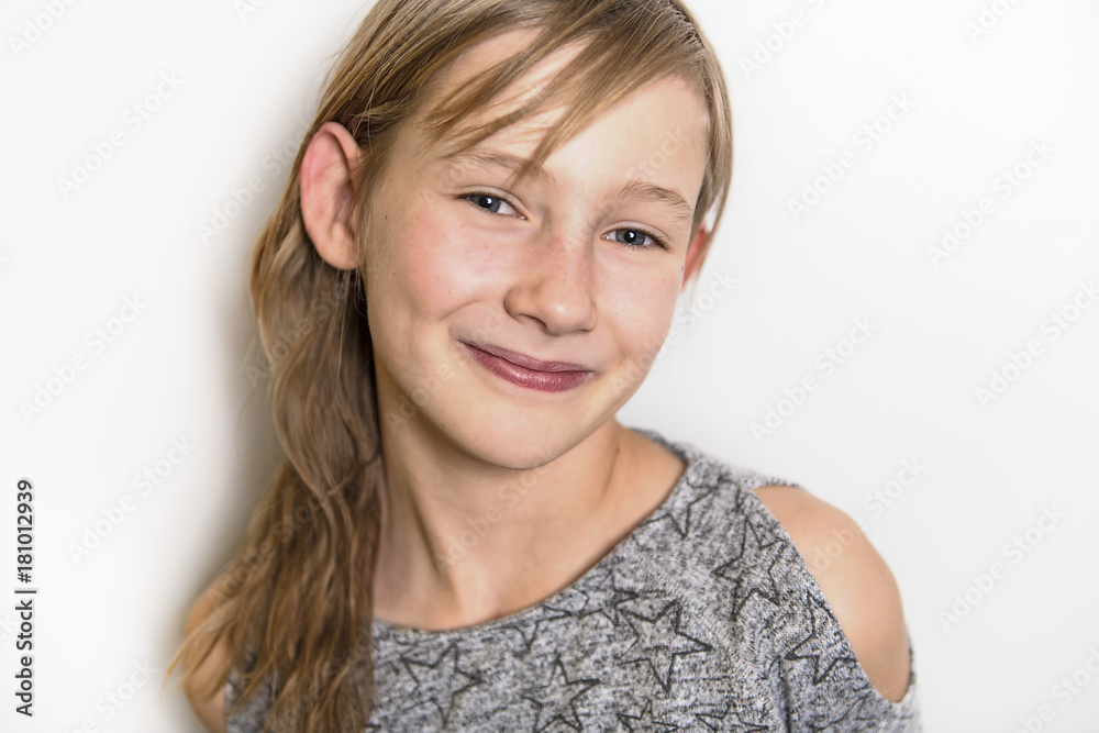cute cheerful little girl portrait, isolated on grey background red head cute cheerful little girl portrait, isolated on grey background red head