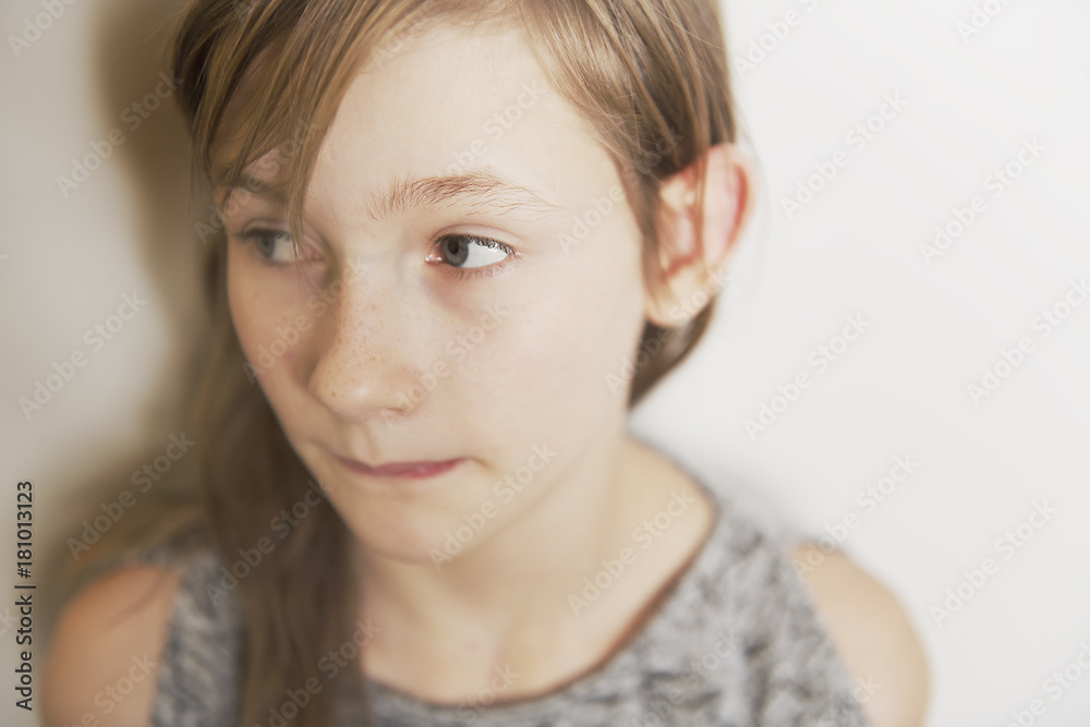 cute cheerful little girl portrait, isolated on grey background red head cute cheerful little girl portrait, isolated on grey background red head