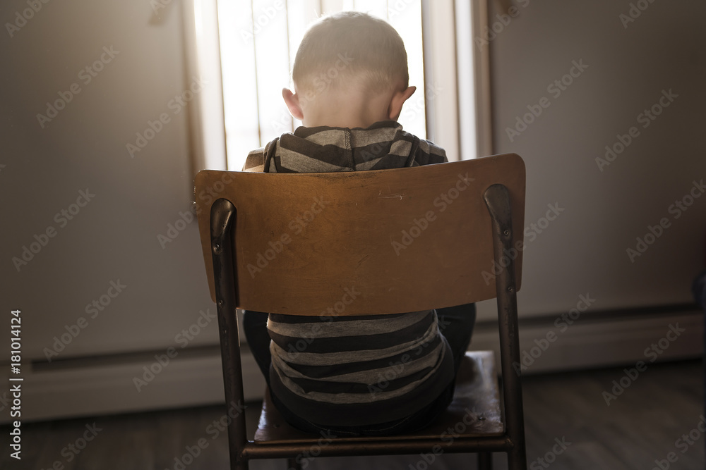 Upset problem child sit on chair concept for bullying, depression stress
