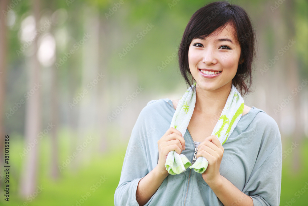 one pretty young asian woman doing morning exercise in the park one pretty young asian woman doing morning exercise in the park
