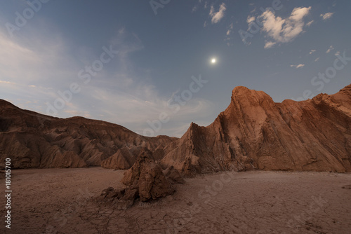 Nocturnal desert landscape at Valle de la Luna lit by moonlight.