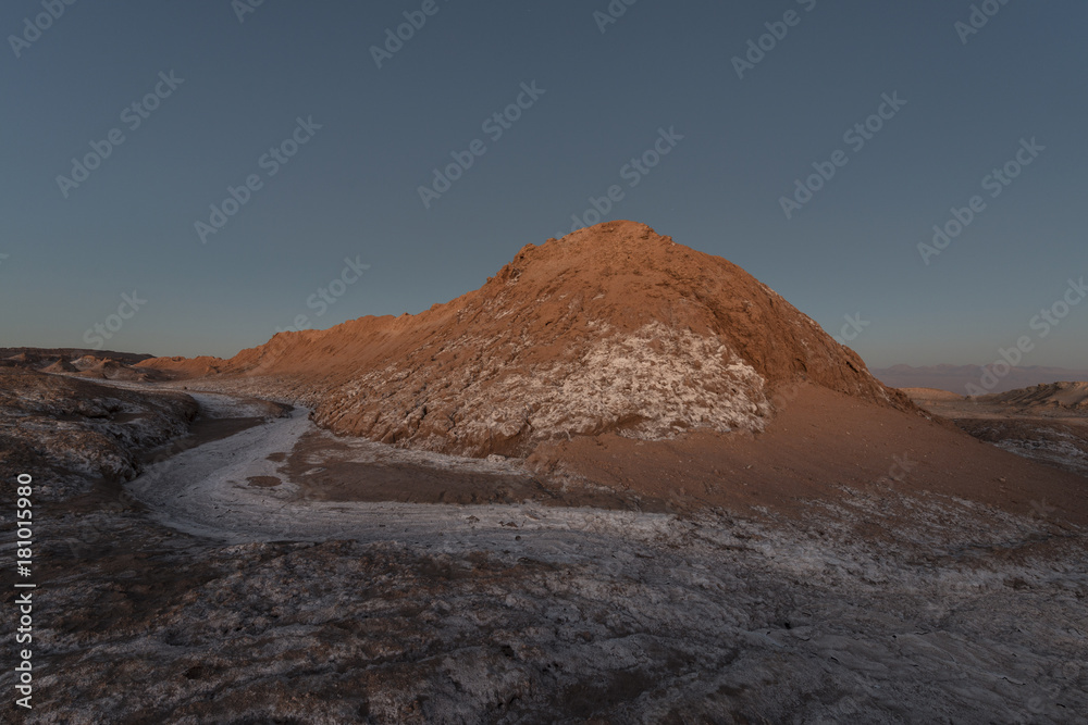 Nocturnal desert landscape at Valle de la Luna lit by moonlight. Stock  Photo | Adobe Stock