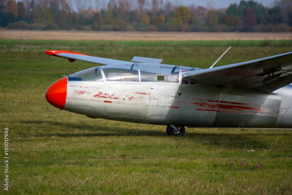 old glider on the grass of the runway old glider on the grass of the runway