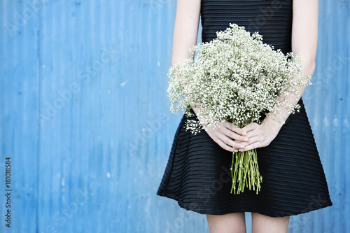 Holding a bouquet of babysbreath photo