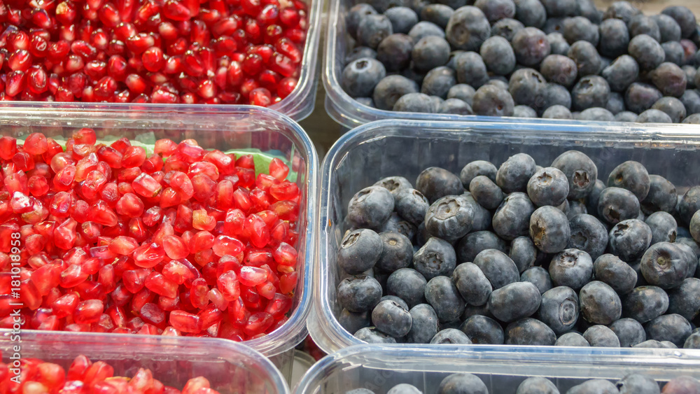 Peeled berries of pomegranate and blueberries Peeled berries of pomegranate and blueberries