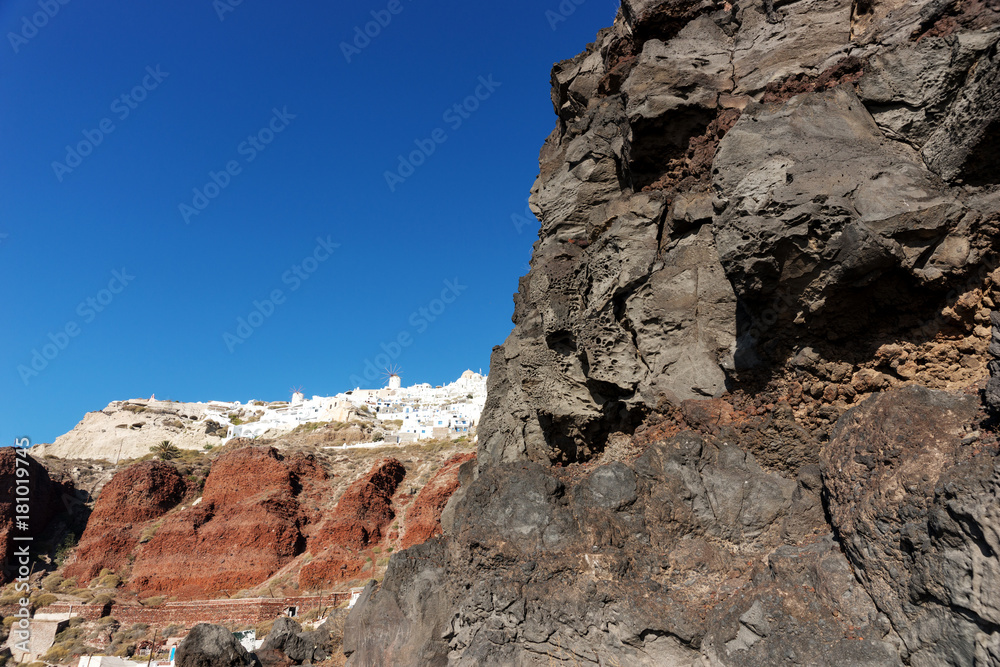 View from the harbor on Oia, a beautiful village on the volcanic island of Santorini in the Mediterranean Sea