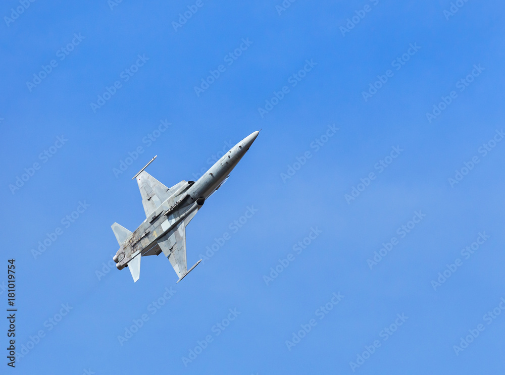 fighter jet military aircraft flying on blue sky background fighter jet military aircraft flying on blue sky background