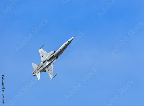 fighter jet military aircraft flying on blue sky background