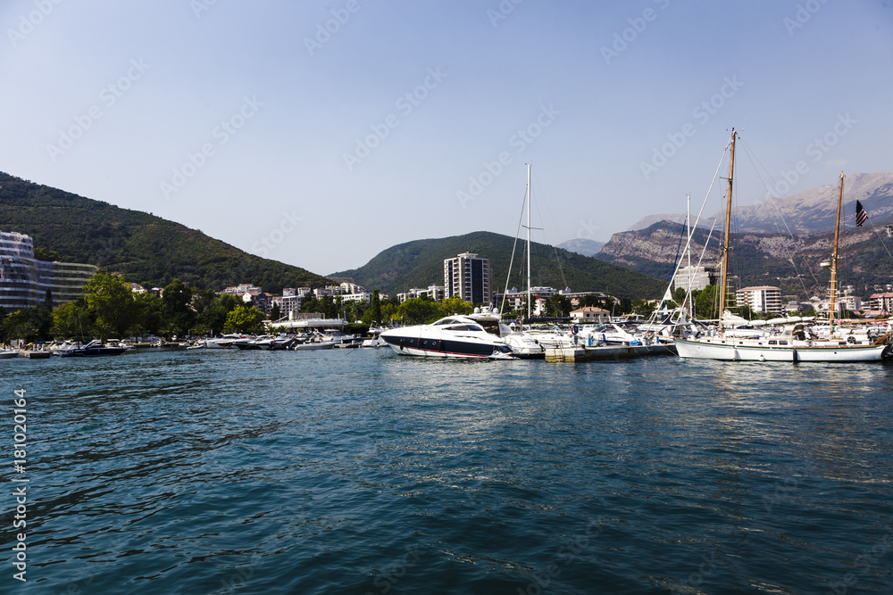 yachts in the background of mountains in budva