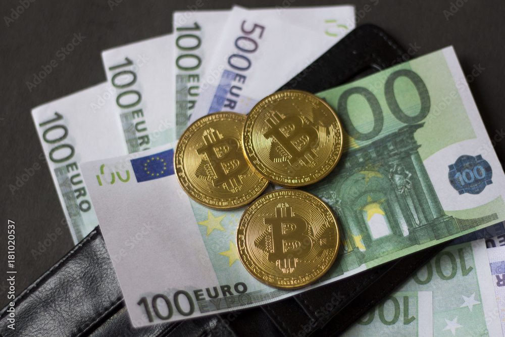 Golden bitcoins and banknotes Euro in my wallet on a black background. the new virtual money Golden bitcoins and banknotes Euro in my wallet on a black background. the new virtual money