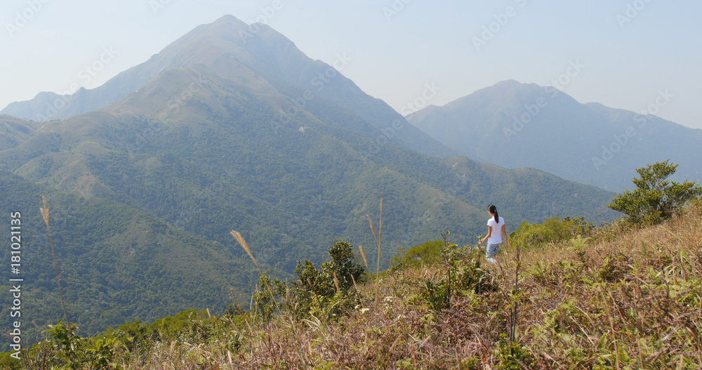 Woman go hiking in mountain
