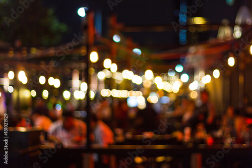abstract blur image of night festival in a restaurant and The atmosphere is happy and relaxing with bokeh for background