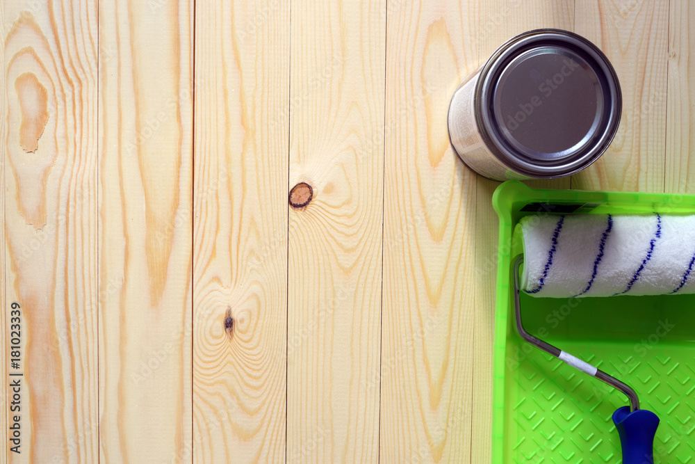 Paint, roller, wooden floor Paint, roller, wooden floor