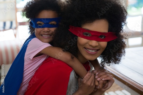 Mother and daughter pretending to be superhero photo