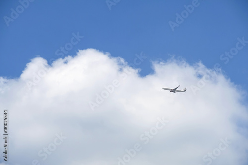 Plane in the blue sky with cloud