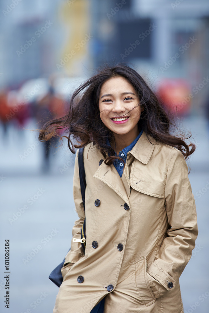 One beautiful young asian woman in the street One beautiful young asian woman in the street