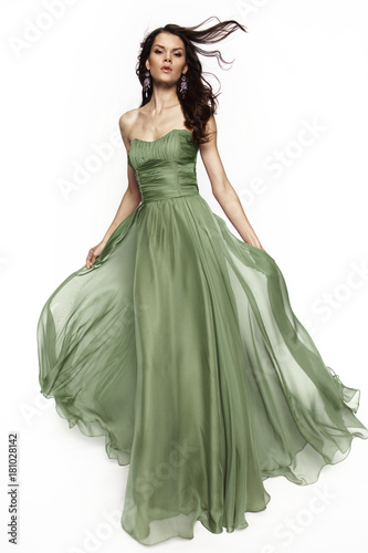 Brunette in a long dress posing