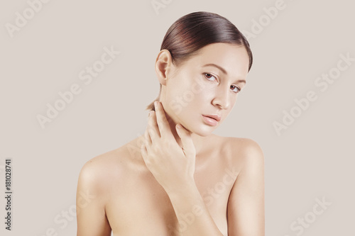 Beauty portrait of a very beutiful brown hair european young girl, nude make up. Studio shoot, white background.