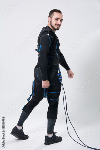 Young fitness man in an electric stimulation