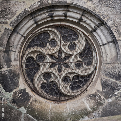 Old gothic cathedral round window.