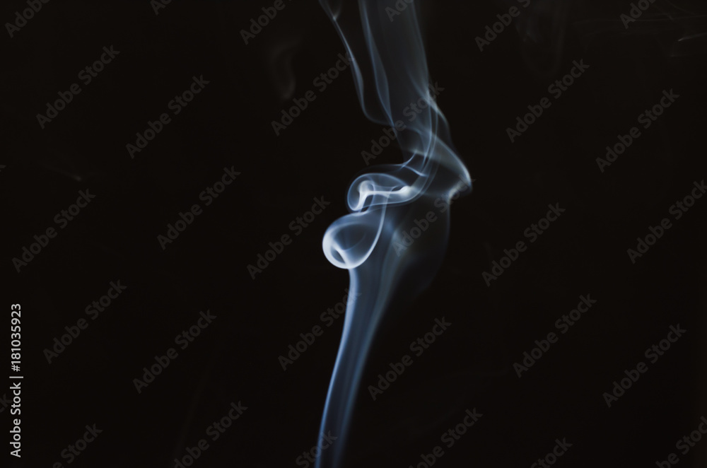 abstract smoke in black background with beautiful motionflow with circle spiral in middle smoke shape same human bone. abstract smoke in black background with beautiful motionflow with circle spiral in middle smoke shape same human bone.