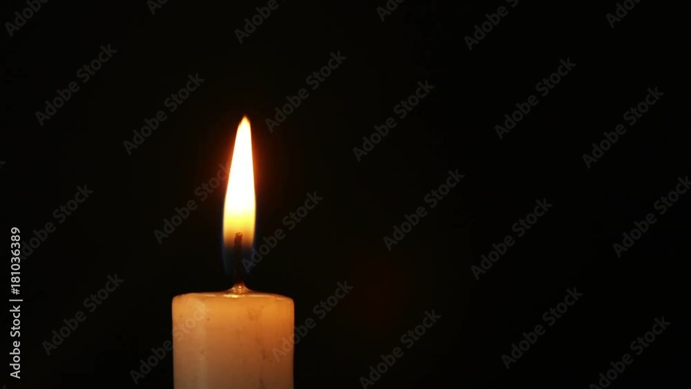 Single lit candle with quite flame Single lit candle with quite flame