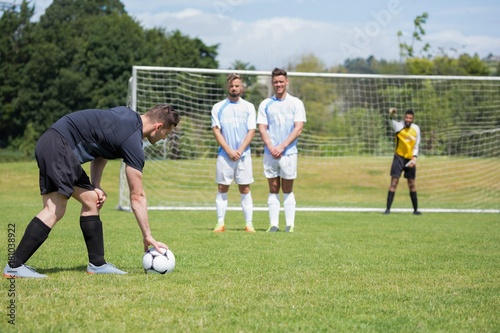 Soccer player is ready to kick ball from penalty spot