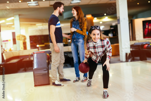Friends enjoying bowling at club