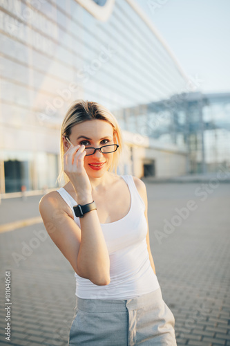 Portrait of a professional business woman in glasses outdoor © Pokhodzhay
