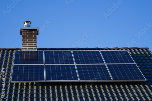 Closeup of photovoltaics on house roof for clean electrical energy