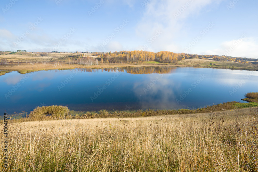Gorodischenskoe lake in the golden autumn. Izborsk, Russia