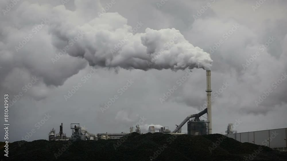Atmospheric Air Pollution From Industrial Smoke Now. Pipes Steel Plant. Thick Smoke and Steam of MDF Production. Works in autumn Cloudy Day. Atmospheric Air Pollution From Industrial Smoke Now. Pipes Steel Plant. Thick Smoke and Steam of MDF Production. Works in autumn Cloudy Day.