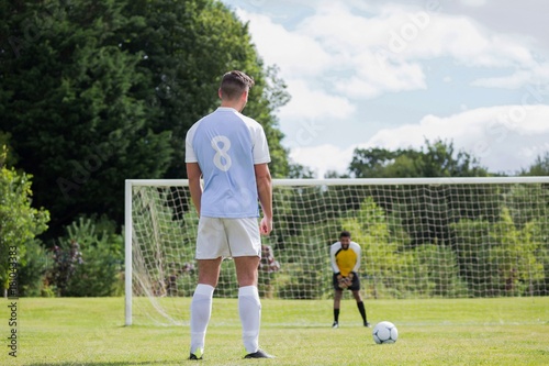 Obraz na plátně Soccer player is ready to kick ball from penalty spot