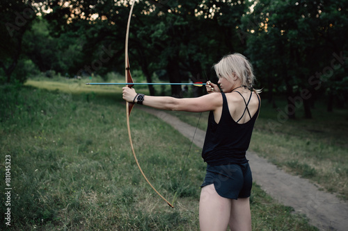 Girl shoots a bow
