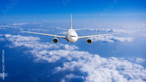 aeroplane flying above clouds. Passenger Airliner flying