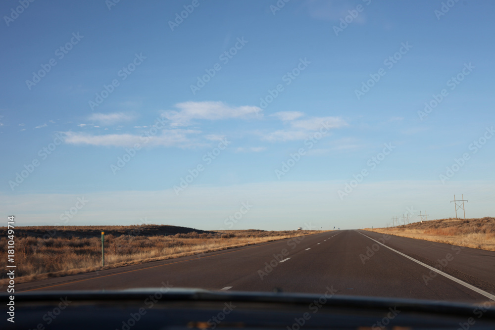 Blue skies and an empty highway road